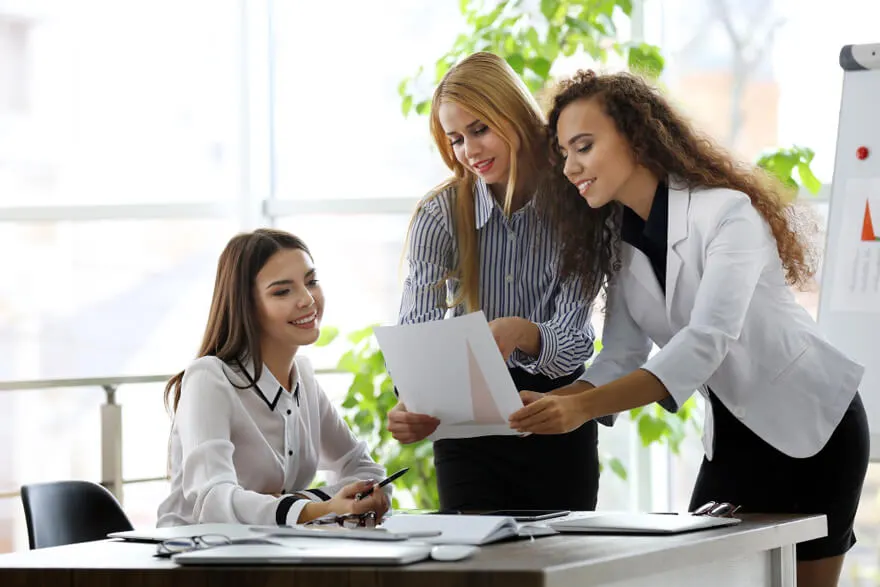 Professionals reviewing workplace policies and documents in an office setting